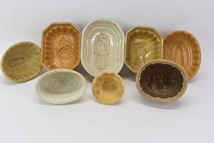 Group of Eight Assorted Stone and Yellowware Molds