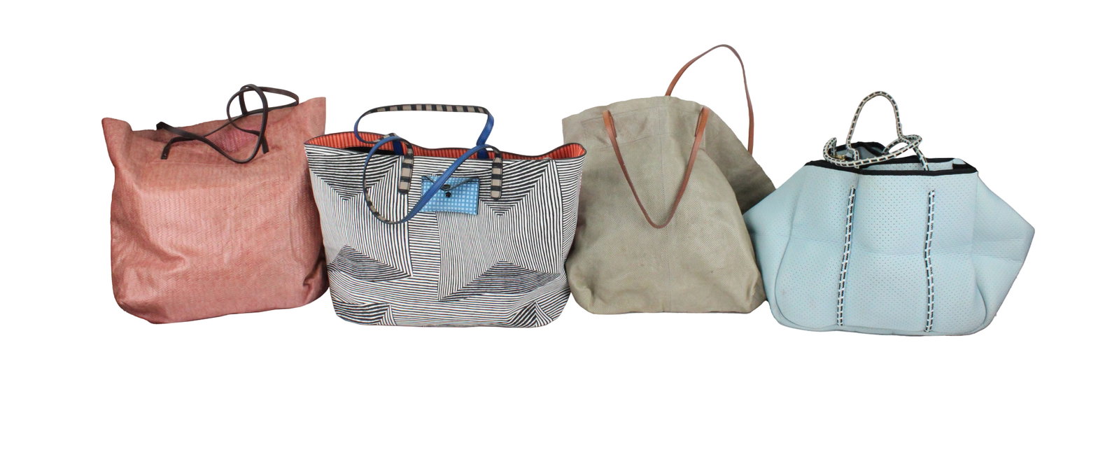 Two Linde Gallery St. Barth Tote Bags: Two Linde Gallery St. Barth Tote Bags Together with a blue neoprene tote bag, and a multi-patterned tote bag. 4 pieces Losses, wear, surface distress. Provenance: The Estate of Susan Chalom, New York,