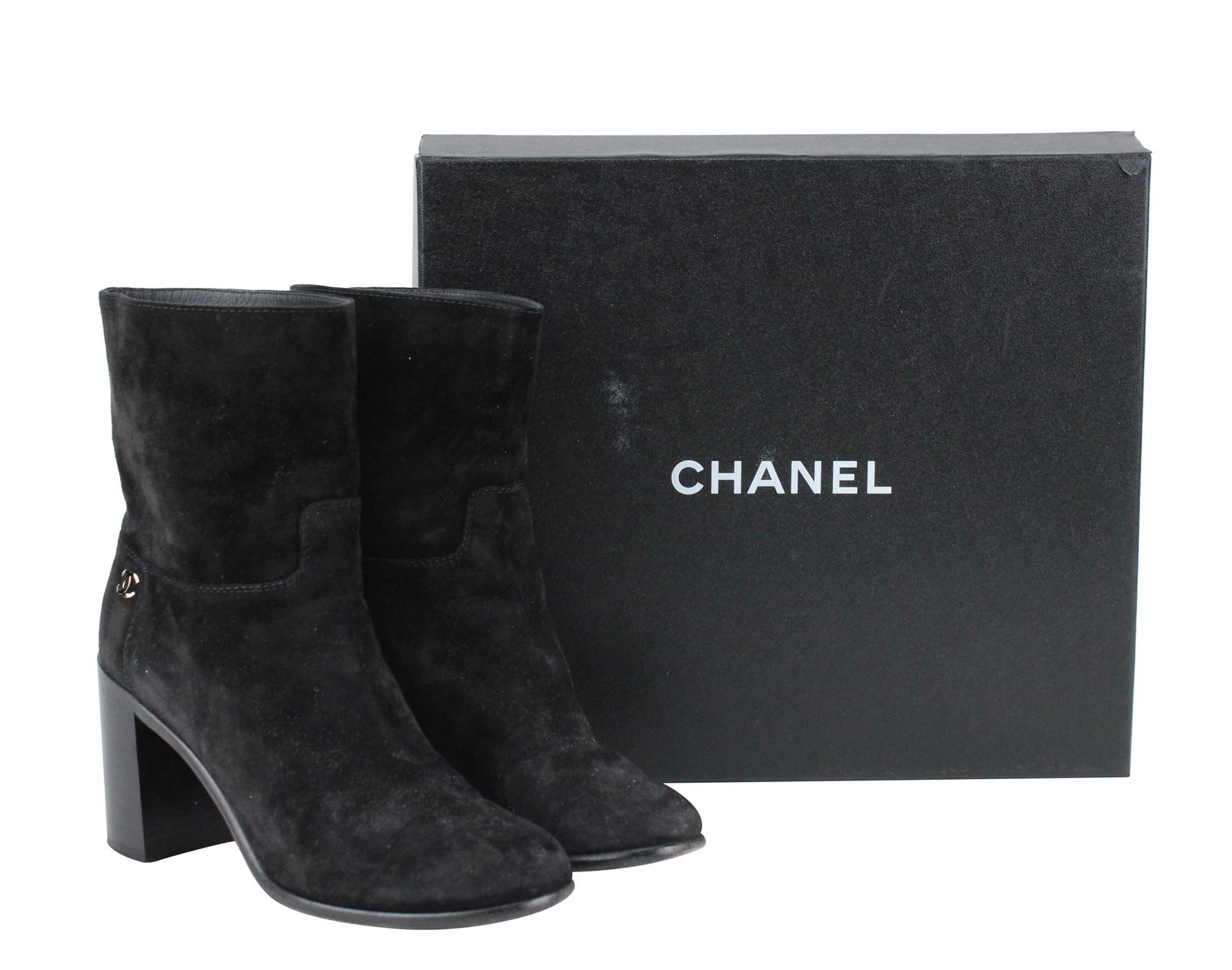 Pair of Chanel Black Suede Pull on Booties: Pair of Chanel Black Suede Pull on BootiesSize 7US / 37EU. With original box and receipt from Bergdorf Goodman.Wear, stains, scuffs associated with use.Provenance: The Estate of Susan Chalom, New York