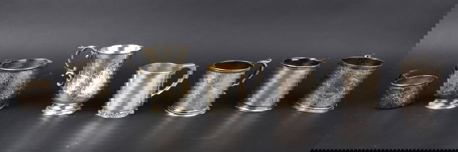 Tiffany Sterling Silver Handled Cup: Tiffany Sterling Silver Handled CupWith vermeil interior and banded foot. Together with a Gorham sterling silver baby cup, a sterling silver footed cup, and a 900/1000 cup. Approx. 18 t.o. Also includ