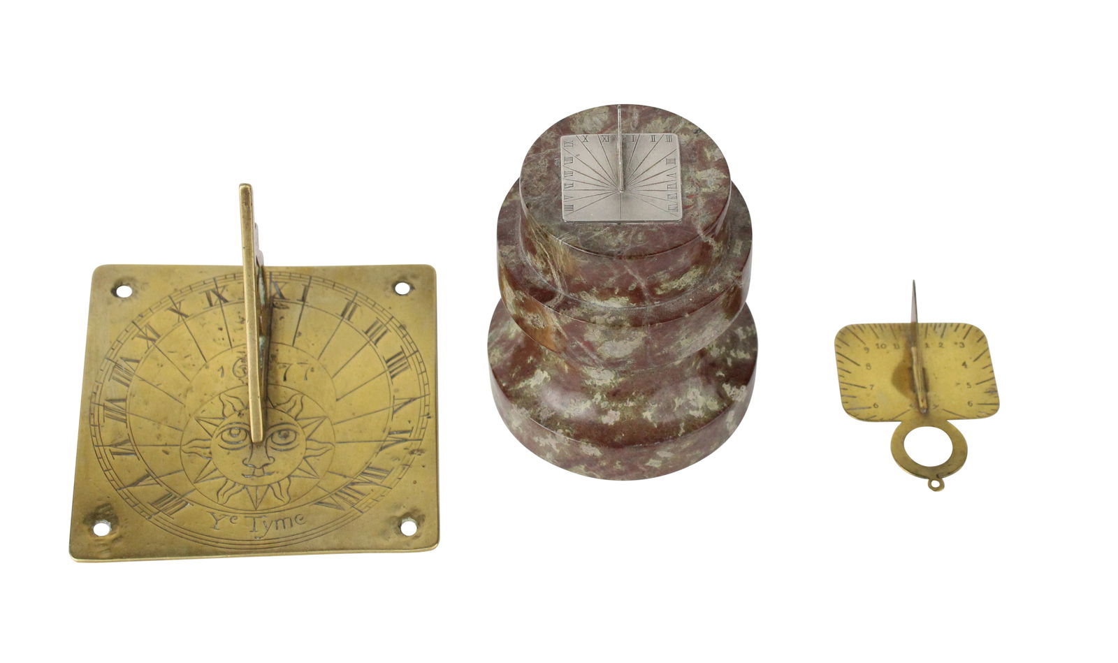Three Sundials: Three SundialsOne silver metal mounted on marble stand and two brass.Largest: 4 x 3 in. (10.2 x 7.6 cm.)
