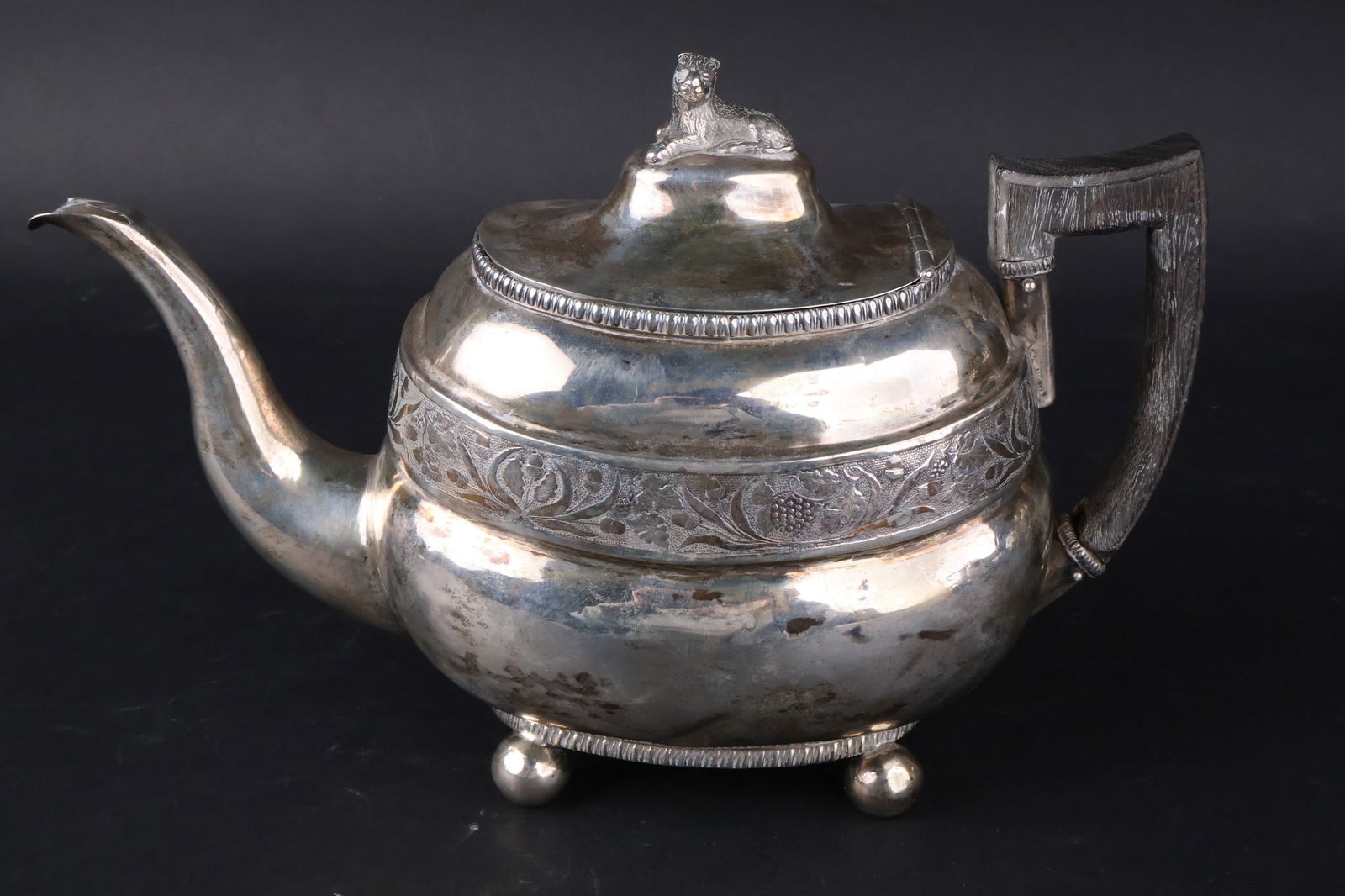American Silver Teapot, J.W. Forbes: American Silver Teapot, J.W. ForbesNew York, (1781-1864). John Wesley Forbes, ca. 1820. Teapot with lion finial, grapevine banding and gadrooned decoration on ball feet, monogram, dents, and losses. A