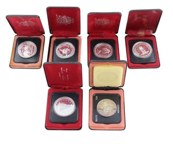 Eighteen Canada Silver Dollars in Cases