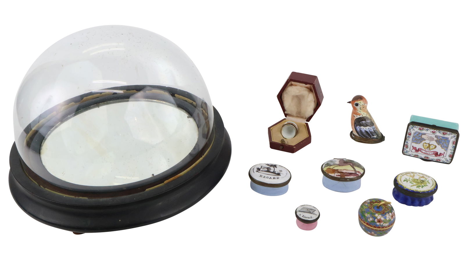Eight Pill Boxes: Eight Pill BoxesBattersea Boxes. Including an apple form cloisonne box, a bird form box, an egg form box, and enamel boxes. Together with a domed glass display case.