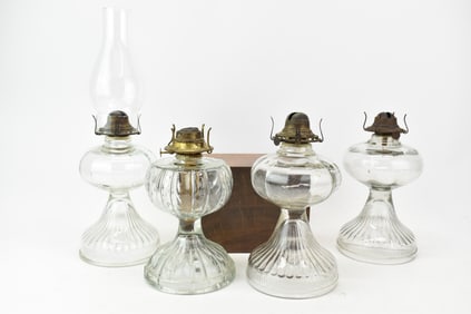 Group of Four Antique EAPG Colorless Glass Oil Lamps.