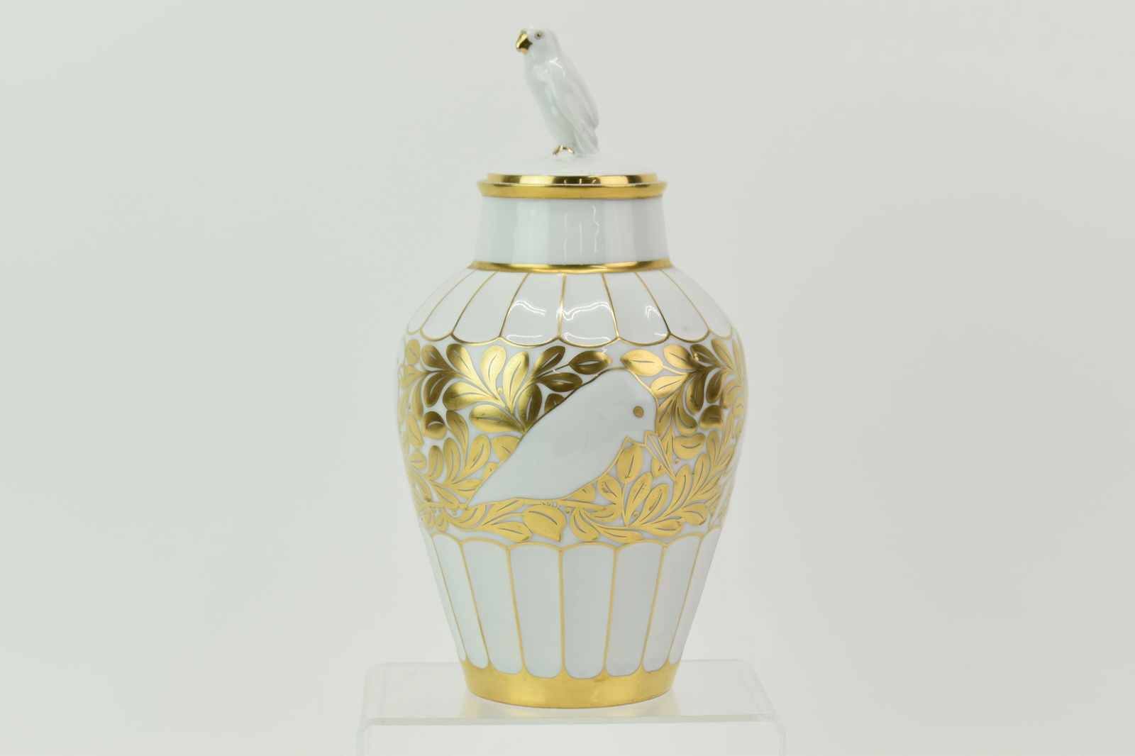 Fritz Klee for Hutschenreuther Lidded Parrot Vase: Fritz Klee for Hutschenreuther Lidded Parrot VaseFritz Klee for Hutschenreuther Lidded Parrot Vase having off-white ground with gilt parrot and leaf decoration and lid with parrot finial; marked at un