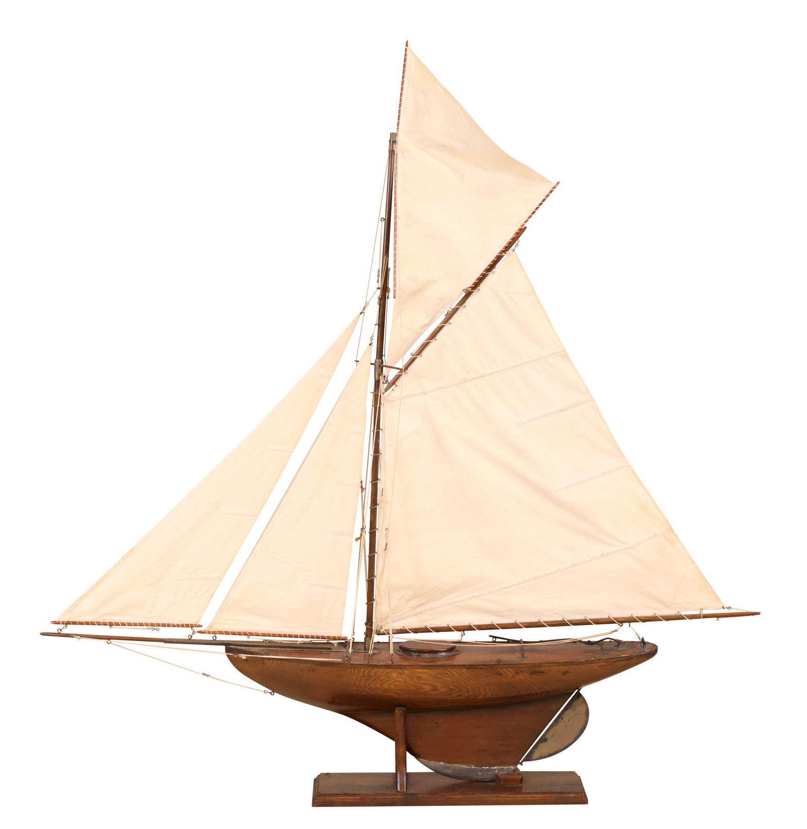 Vintage Brass and Lead Mounted Wood Keeled Pond Boat: Vintage Brass and Lead Mounted Wood Keeled Pond Boat20th C.Fitted on stand. Break to one sail support.Appx 53 x 6 1/2 x 50 in. (134.6 x 16.5 x 127 cm.)