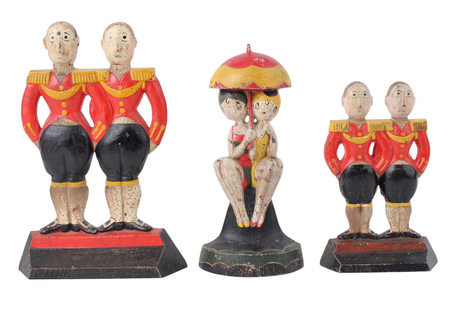 Three Fish Painted Cast-Iron Doorstops: Three Fish Painted Cast-Iron DoorstopsComprising, two Double Footmen and one Bathing Beauties.Losses, wear, surface distress.Largest: 12 x 8 1/2 x 2 in. (30.5 x 21.6 x 5.1 cm.)