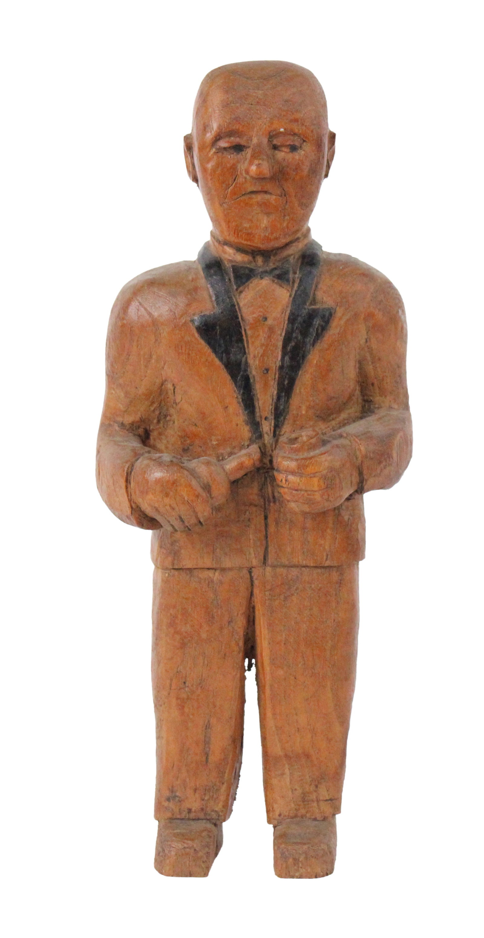 Carved and Painted Pine Figure of a Man in Tuxedo: Carved and Painted Pine Figure of a Man in TuxedoAmerican, 19th/20th C.Some wear, surface distress.Provenance: Property from a Private New England Collection13 x 5 1/2 x 3 1/2 in. (33 x 14 x 8.9 cm.)