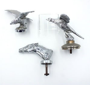 Three Decorative Hood Ornaments