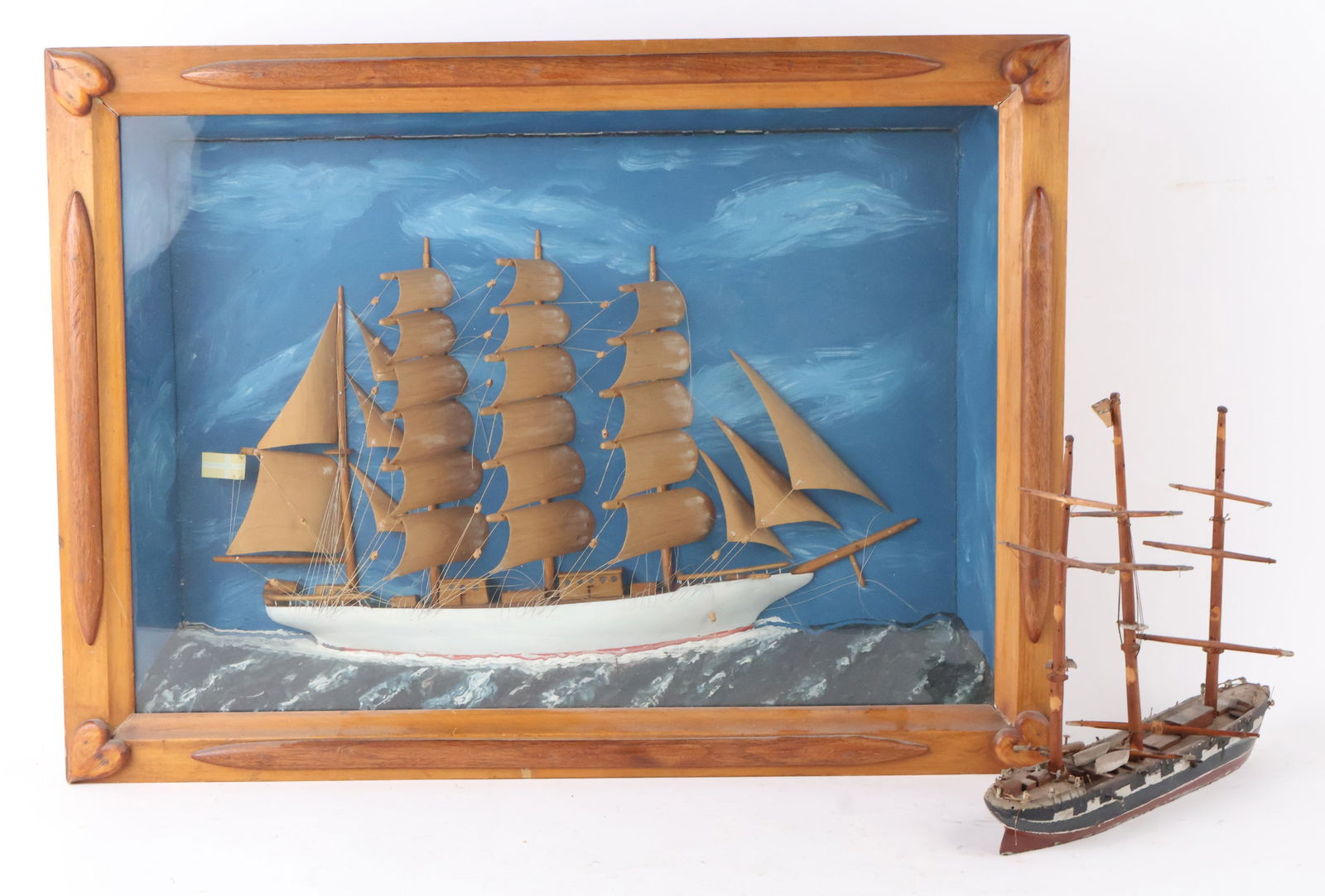 Ship Model Diorama of a Clipper Ship: Ship Model Diorama of a Clipper ShipTogether with a painted wood ship model.Losses, wear, surface distress.Diorama: 20 x 27 x 5 in. (50.8 x 68.6 x 12.7 cm.)