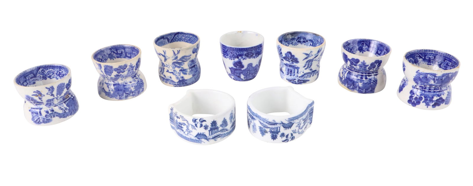 Six Blue and White Porcelain Egg Cups: Six Blue and White Porcelain Egg CupsTogether with a small cup and two napkin rings.Egg Cup: 1 3/4 x 2 in. (4.4 x 5.1 cm.)