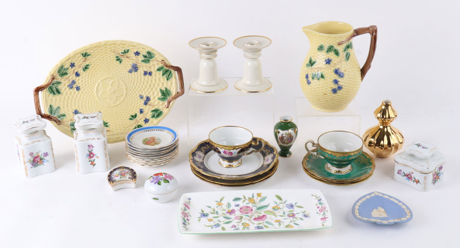 Group of Assorted Porcelain Table Articles: Group of Assorted Porcelain Table ArticlesIncluding, a Tiffany & Co. pitcher and plate, three Bavarian teacups and saucers, a vanity set, a Wedgwood plate, and a Jonathan Adler vase. 31 pieces.Wear, c
