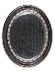 Regency Ebonized and Parcel-Gilt Oval Mirror