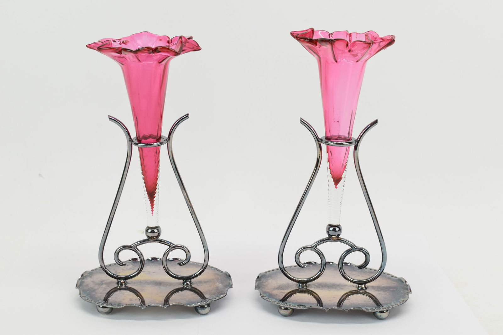 Pair of Silver Plated Cranberry Glass Epergne's: Pair of Silver Plated Cranberry Glass Epergne'sPair of Silver Plated Cranberry Glass Epergne's. Used condition, overall size 8 3/4" tall x 5" x 3 1/2"