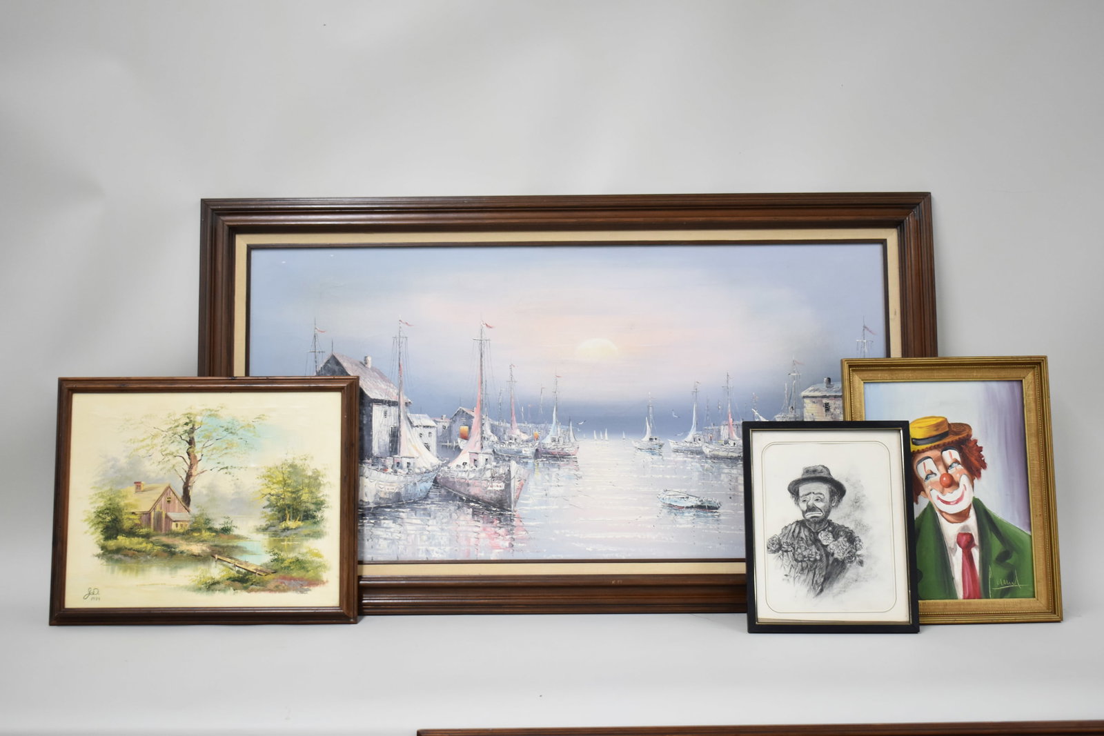 Group of Assorted Artwork: Group of Assorted Artwork Group of Assorted Artwork. Comprising Oil on Canvas of Boats in Fishing Warf, Oil on Canvas signed T. Giles Landscape depicting snowy mountains above a lakeside, Oil on Canva