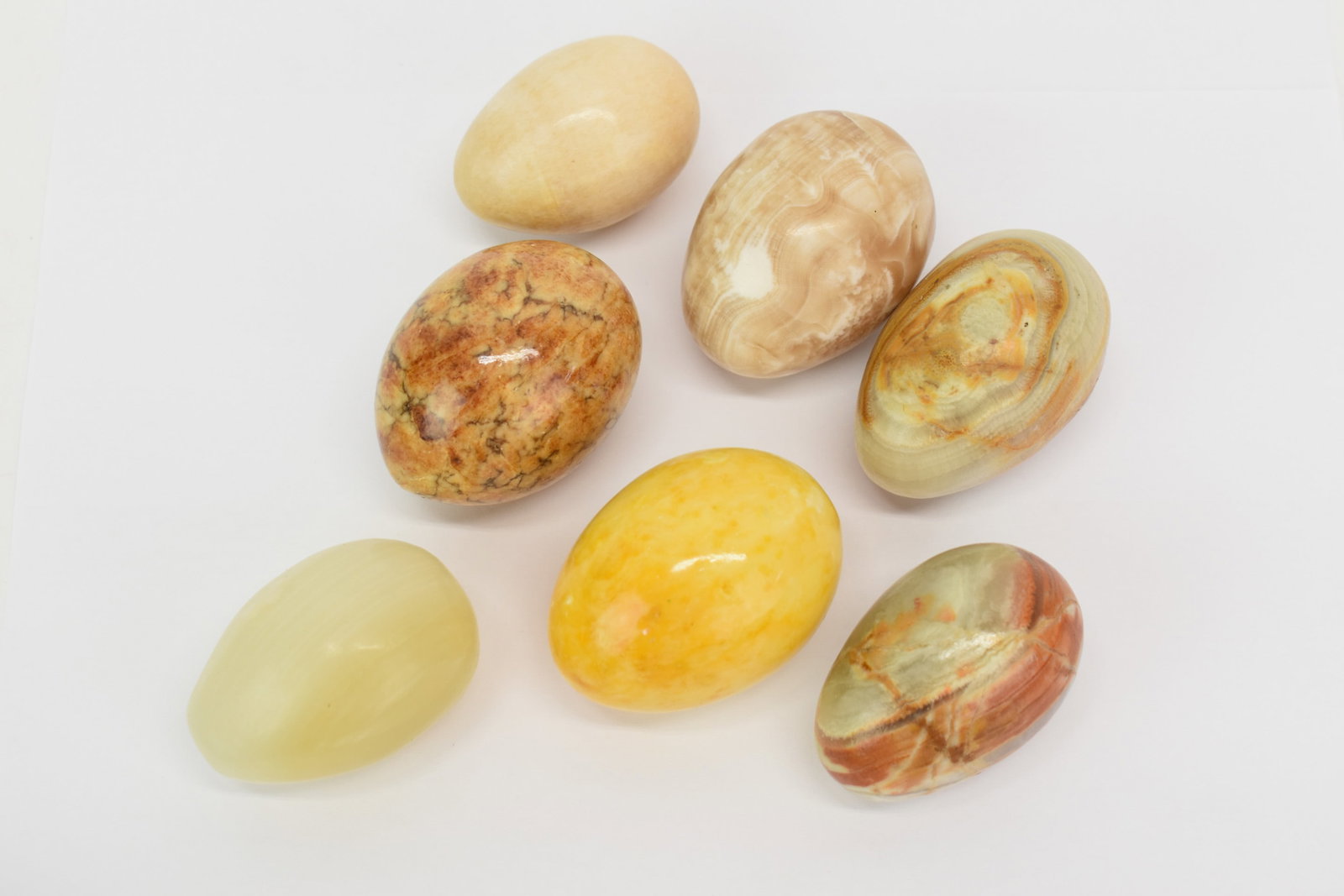 Group of Seven Assorted Hardstone Eggs: Group of Seven Assorted Hardstone Eggs Group of Seven Assorted Hardstone Eggs. Used condition, largest eggs is approximately 2 1/4" x 1 3/4"