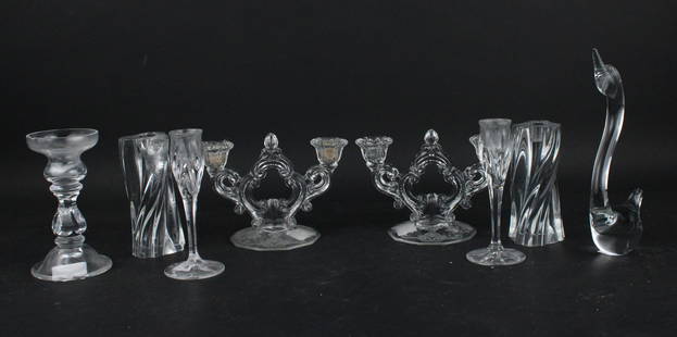 Two Baccarat Crystal Odilon Candle Holders: Two Baccarat Crystal Odilon Candle HoldersTogether with a Cartier candle holder, a pair of etched glass candle holders, a pair of unmarked candle holders, and a glass bird. 8 pieces.Cracks, chips, wea