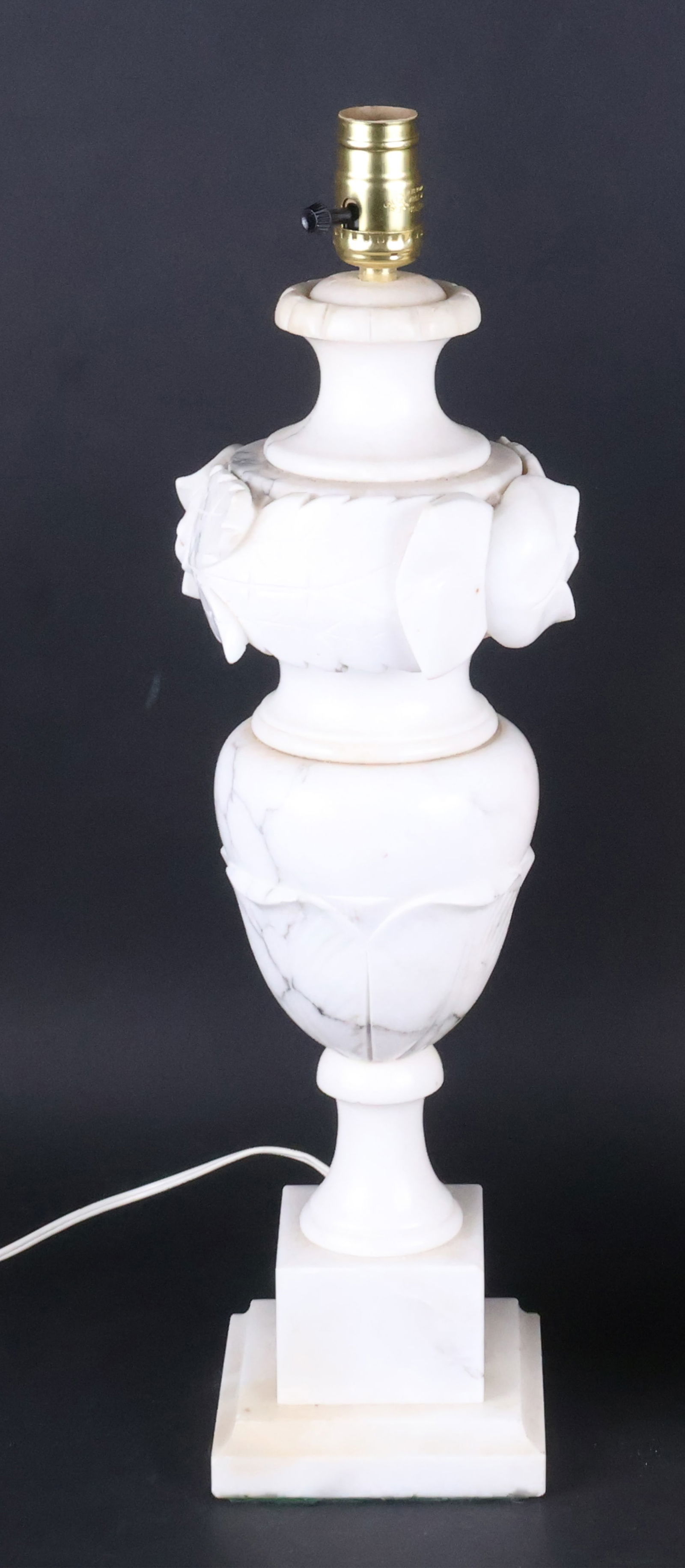 Carved Alabaster Table Lamp: Carved Alabaster Table Lamp20th C.Loose, wear.22 1/2 x 5 1/2 x 5 1/2 in. (57.2 x 14 x 14 cm.)