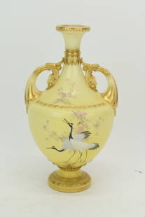 Royal Worcester Crane Decorated Yellow Vase: Royal Worcester Crane Decorated Yellow VaseRoyal Worcester Crane Decorated Yellow Vase having figural facial handles. Used condition, 9" tall x 5" diameter
