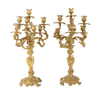 Pair of Louis XV Cast and Gilt Bronze Seven Light Candelabrum: Pair of Louis XV Cast and Gilt Bronze Seven Light CandelabrumFrench, 19th c. each with foot stamped "Depose"Provenance: Le Roy Antiques, NYC, Dec. 1, 1969, $80024 x 12 in. (61 x 30.5 cm.)