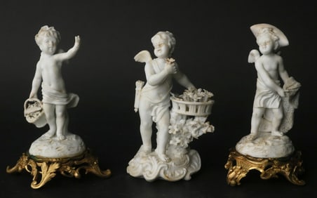 Three Bisque Porcelain Putti Figures