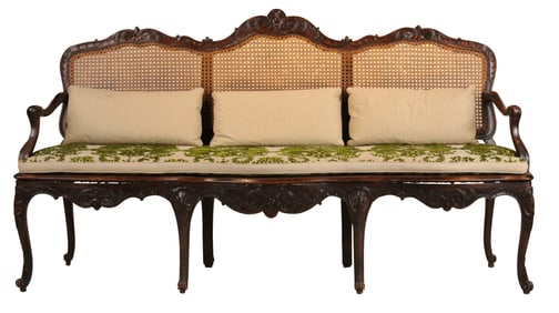 Regence Carved Walnut Caned Back Settee