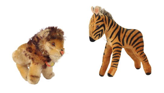 Two Steiff Stuffed Animals: Two Steiff Stuffed AnimalsComprising, Zora Zebra and Leo Lion.Losses, wear.Lion: 4 1/2 x 4 x 4 in. (11.4 x 10.2 x 10.2 cm.), Zebra: 5 3/4 x 5 x 2 in. (14.6 x 12.7 x 5.1 cm.)