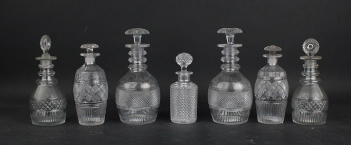 Seven Colorless Glass Decanters