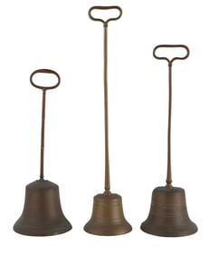 Three Regency Brass and Lead Handled Door Stops