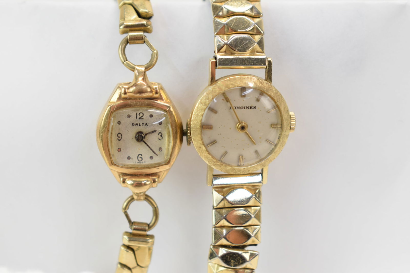 Ladies Balta Swiss Marked 14K Wristwatch: Ladies Balta Swiss Marked 14K WristwatchLadies Balta Swiss Marked 14K Wrist Watch. Inscribed on back P. A. K. 6-21-49 and weighs approx. 1 dwt of 14k. Together with Longines 14k gold wrist watch. Used