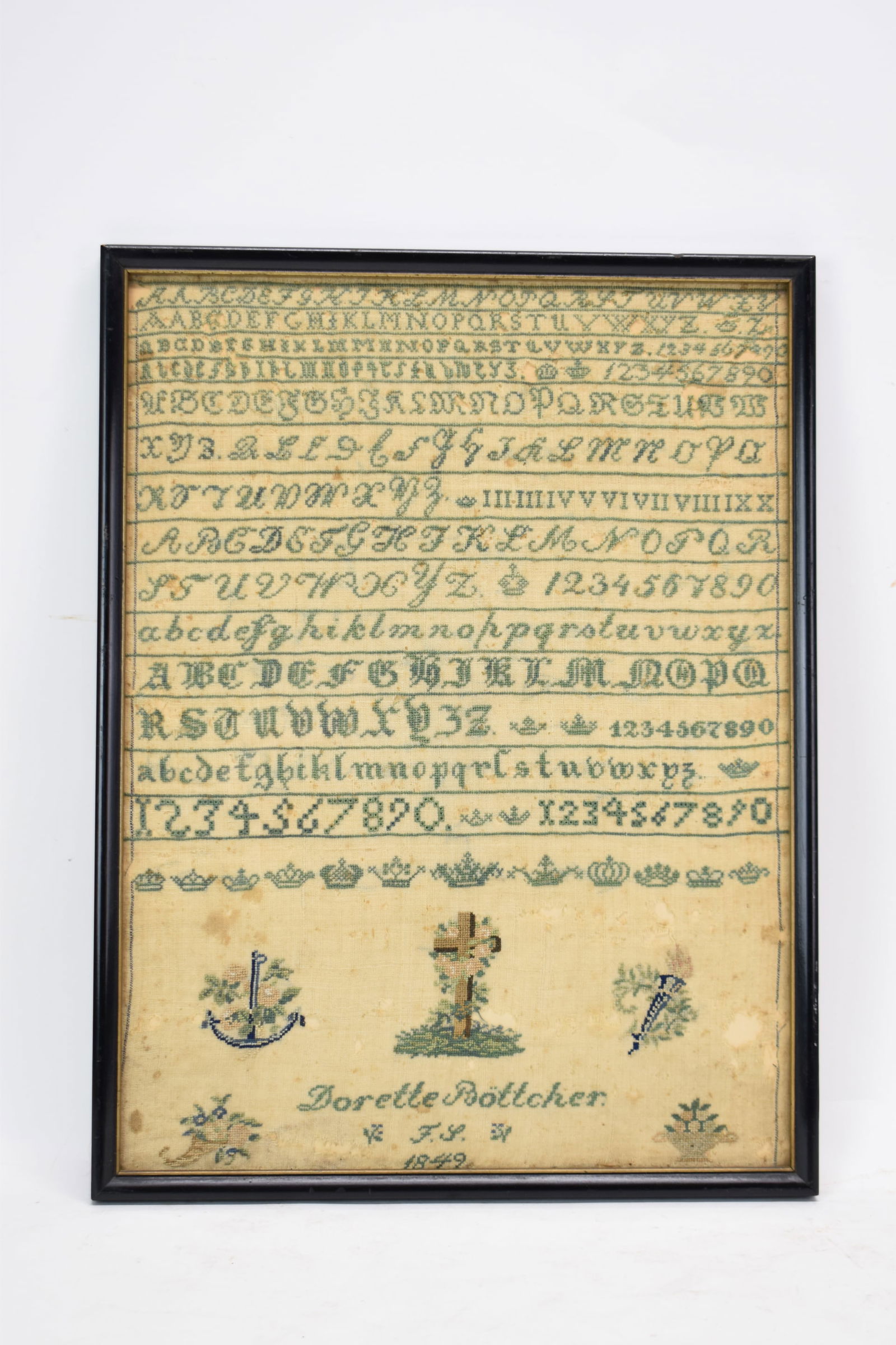 Sampler By Dorette Bottcher Dated 1849: Sampler By Dorette Bottcher Dated 1849Sampler by Dorette Bottcher From 1849 featuring multiple alphabets and numbers in vivid green with various vignettes, a decorative row of crowns, and a dedication