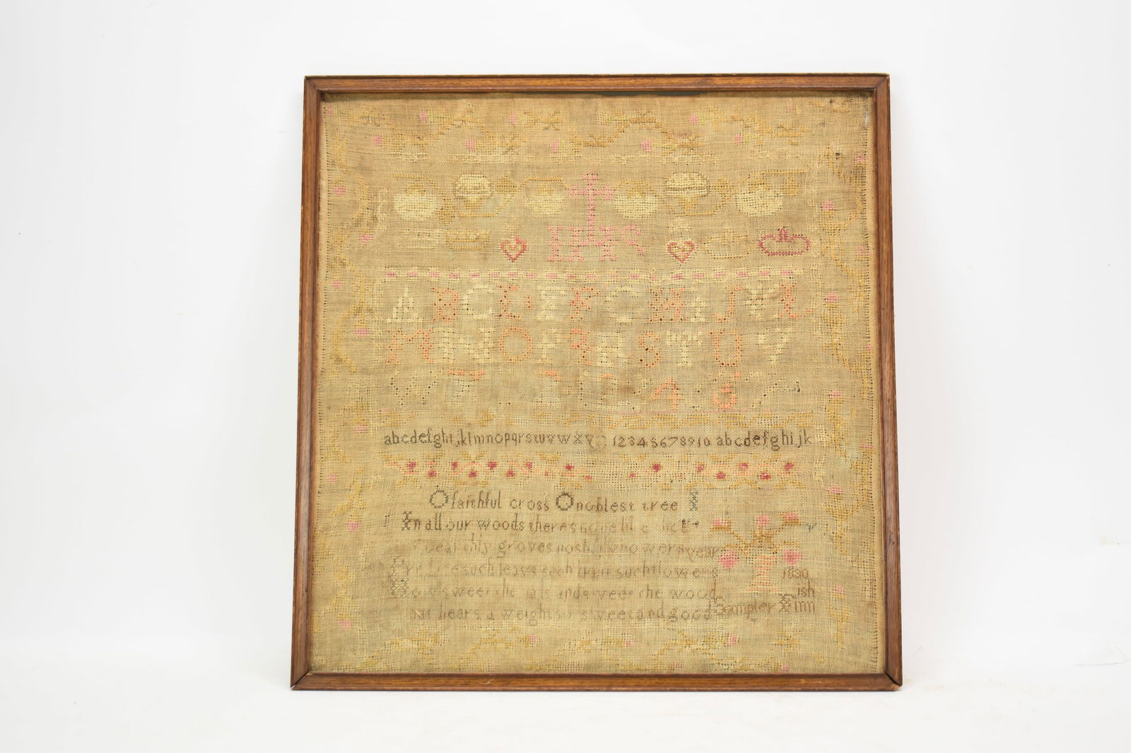 Sampler Dated 1830: Sampler Dated 1830Sampler Dated 1830 featuring alphabets and numbers with hearts, crosses and other decoration with floral border, embroidered in pink, red, orange, cream, black, and green framed in a
