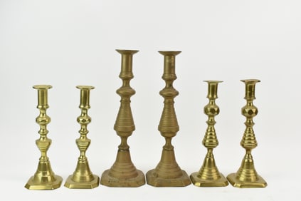 Three Pairs of Antique Brass Candlesticks