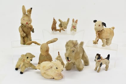 Group of Assorted Stuffed Animals and Mechanical Toys