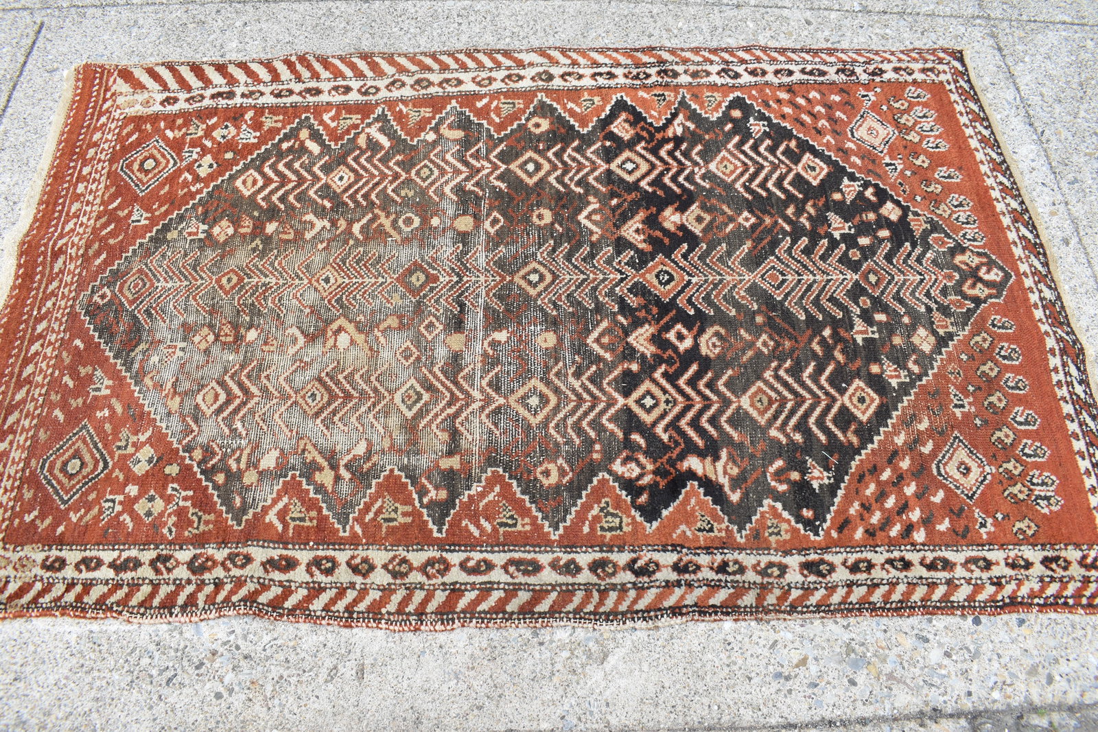 Turkish Style Area Rug: Turkish Style Area Rug Turkish Style Area Rug, having central brown ground with geometric design. Used condition, wear, worn, losses. 78" x 46 1/2"