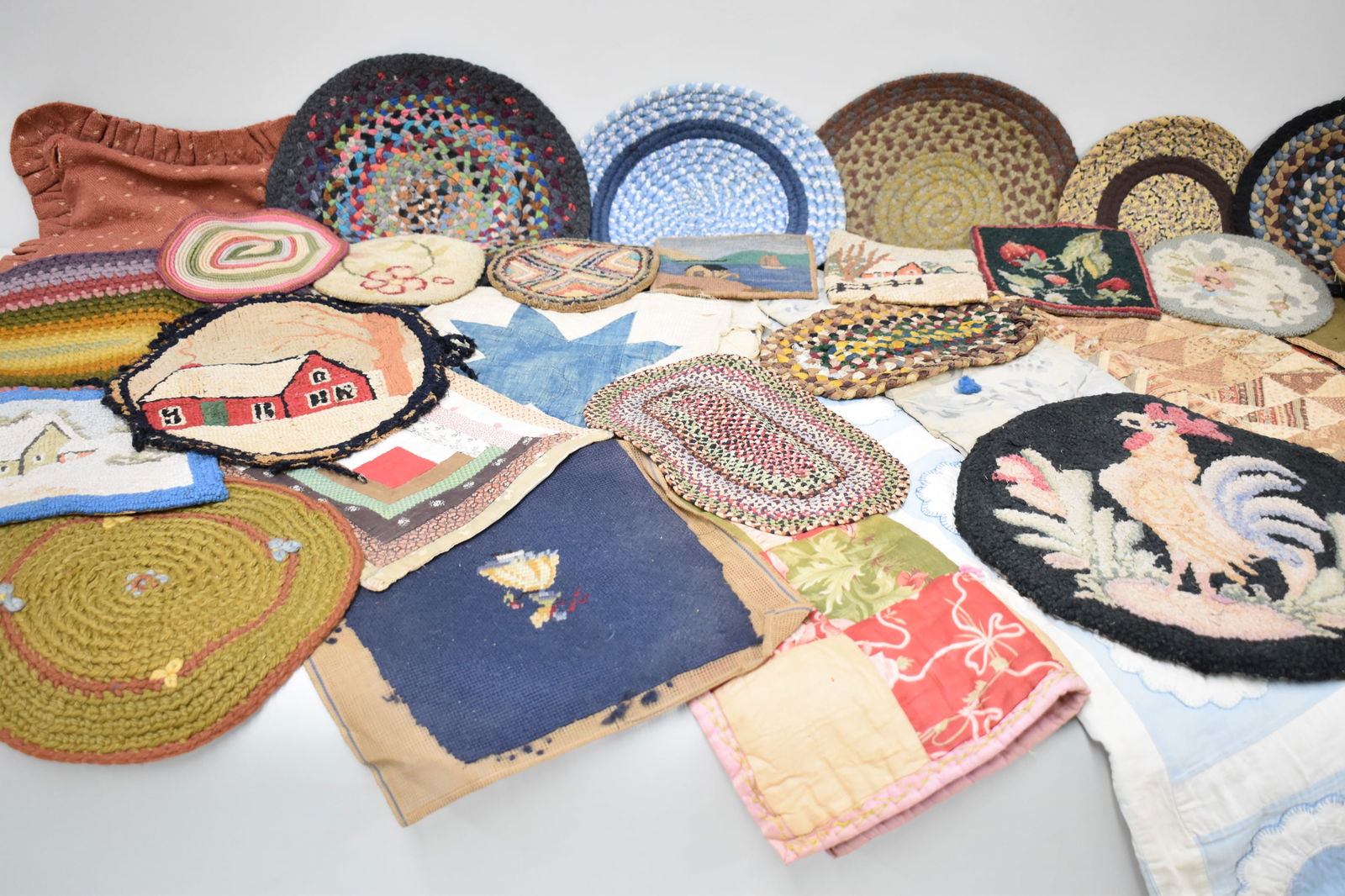 Vintage Group of Assorted Hooked and Quilted Materials: Vintage Group of Assorted Hooked and Quilted MaterialsVintage Group of Assorted Hooked and Quilted Materials. Including Hooked rug hot plates and pot holders, table runners, baby and doll quilts, quil