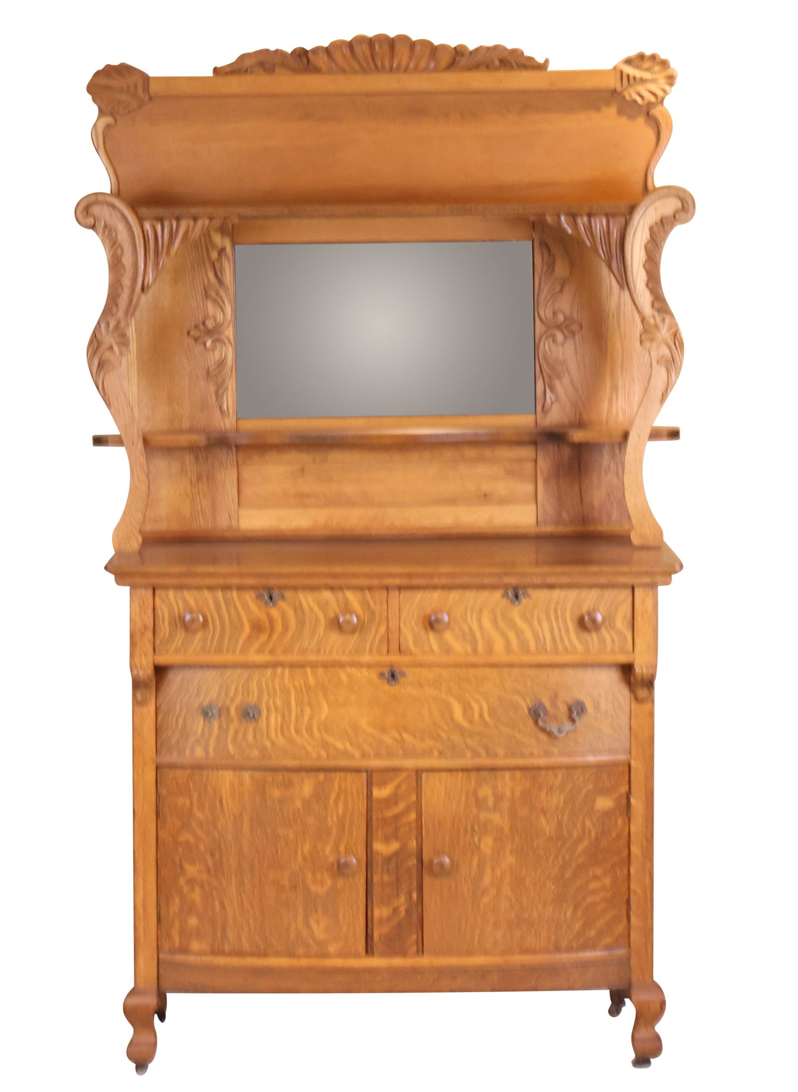 Carved Oak Cabinet: Carved Oak Cabinet American, 20th C. on casters. 78 x 45 x 21 in. (198.1 x 114.3 x 53.3 cm.)