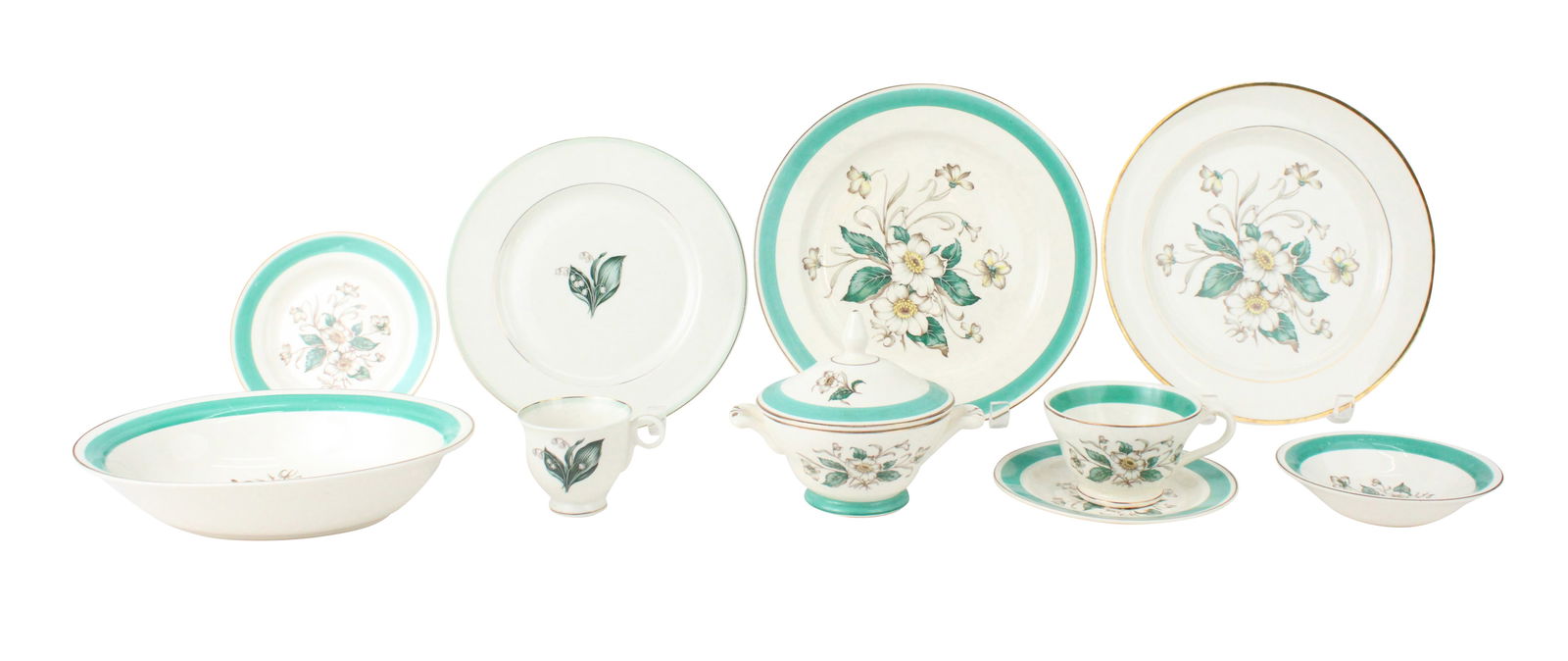 Group of Knowles "Magnolia" Dinnerware: Group of Knowles "Magnolia" DinnerwareComprising, 5 dinner plates, 3 fruit bowls, 5 teacups and 6 saucers, 9 bread plates, a serving bowl, and a covered sugar bowl. Together with 5 Knowles "Carolina"