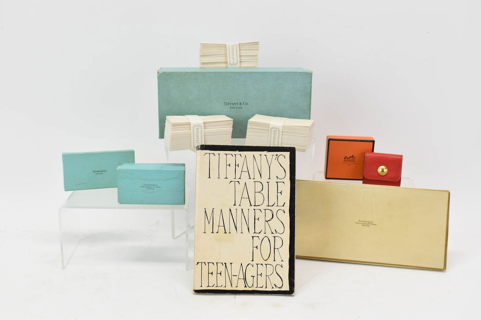 Vintage Hermes Red Cased Post It Holder: Vintage Hermes Red Cased Post It HolderVintage Hermes Red Cased Post It Holder. Together with Tiffany's Table Manners for Teenagers booklet, Four Tiffany box's and a group of 3 1/4" x 1 3/4" envelopes