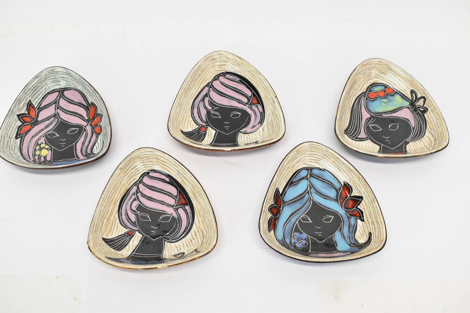 Set of Five MCM Italian Portrait Trays: Set of Five MCM Italian Portrait TraysSet of Five MCM Italian Portrait Trays triangular in form with leather wrapped backside. Used condition, wear to leather 5" x 4 3/4" x 1"