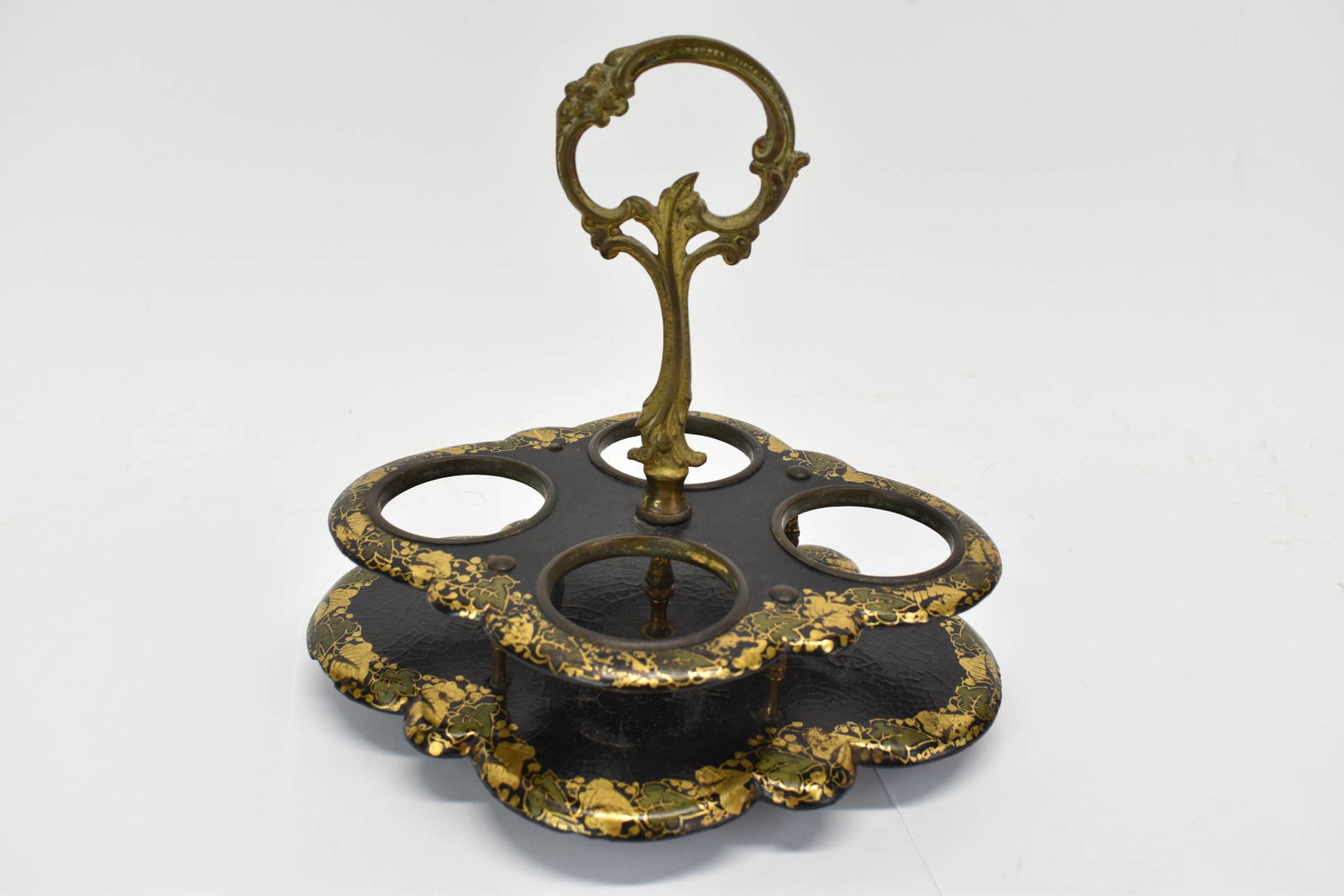 Vintage Chinoiserie Paper Mache Cruet Stand: Vintage Chinoiserie Paper Mache Cruet Stand Vintage Chinoiserie Paper Mache Cruet Stand with gold gilt floral pattern and brass handle. Measures 9" x 7 1/4" x 8 1/2". Used condition, wear, worn.