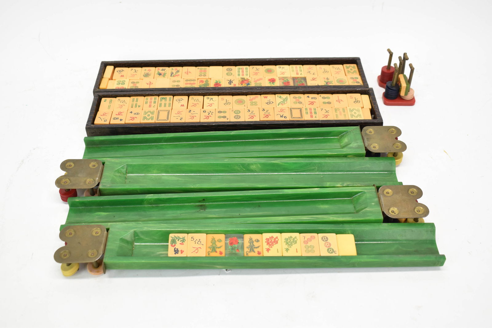 Vintage Mahjong Set: Vintage Mahjong SetVintage Mahjong Set, With trays, tiles, scorekeepers. Together with a newer Mahjong set. Used condition, wear, worn.3 3/4 x 20 x 8 1/2 in. (9.5 x 50.8 x 21.6 cm.)