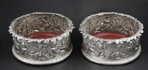 Two Sterling Repousse Wine Bottle Coasters
