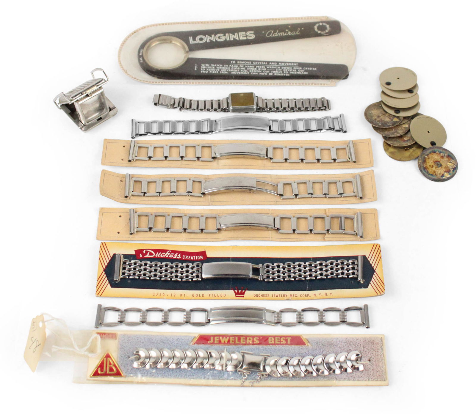 Seven Mid-Century Watch Bracelets: Seven Mid-Century Watch BraceletsNew-old stock metal, Together with a Longines Admiral case back opener and thirteen new-old stock Movado "Museum" watch dials and several cases.