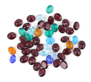 Seven Packages of Pre-War Cut Gemstones