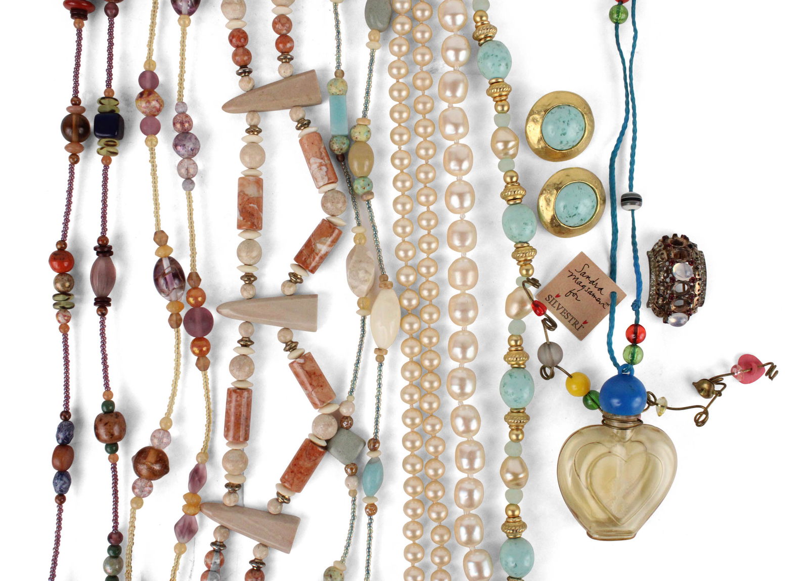 Collection of Costume Jewelry: Collection of Costume JewelryIncluding a Trifari brooch with losses, two Monet gold tone necklaces and a matching bracelet, a Monet faux pearl necklace, a faux unmarked pearl necklace, four MEI FA bea