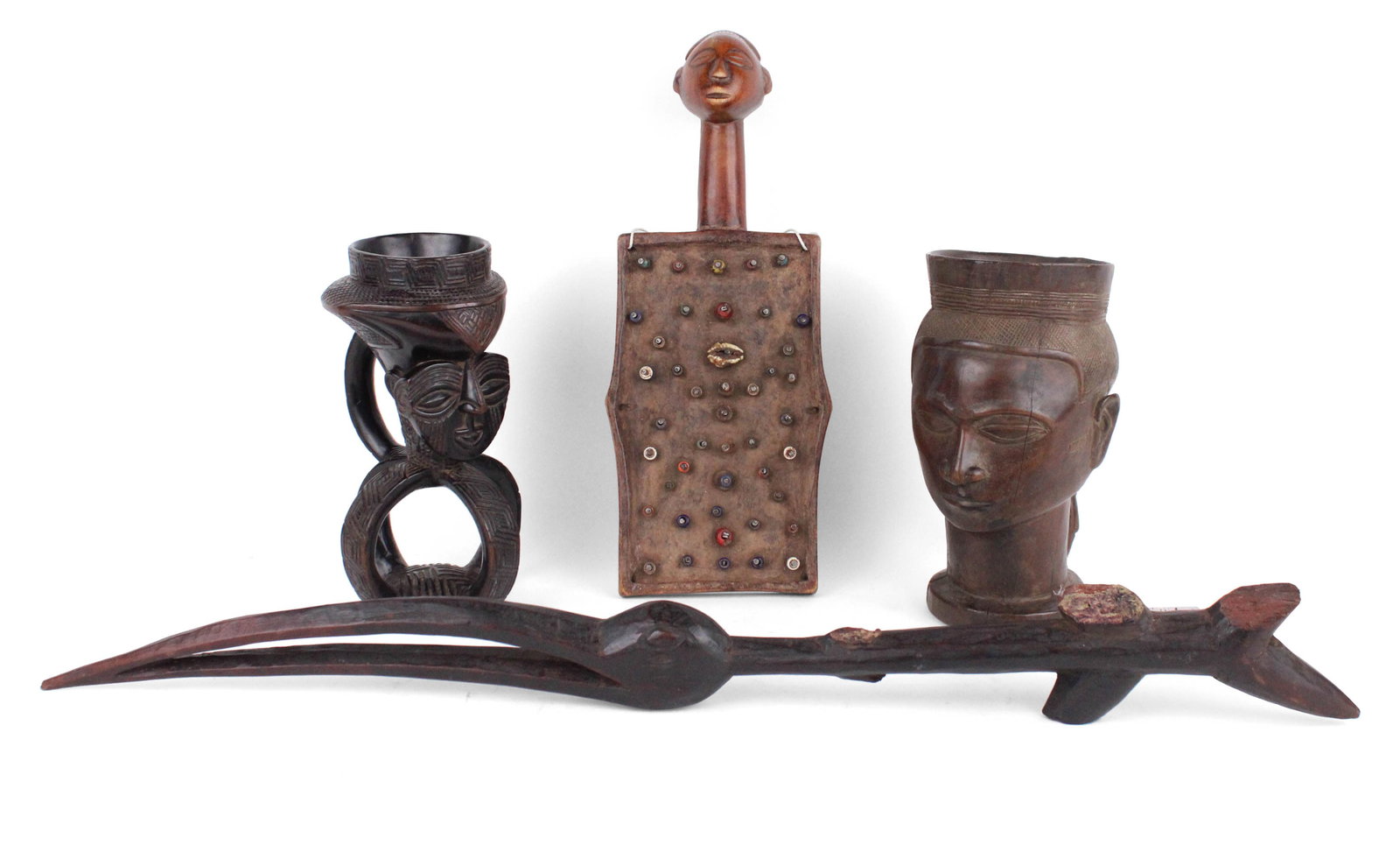 Two Kuba Palm Wine Cups: Two Kuba Palm Wine CupsProbably reproductions. Together carved hardwood bird head fragment and a Luba memory board. 4 piecesCracks, losses, wear.Largest: 30 1/2 in. (77.5 cm.)