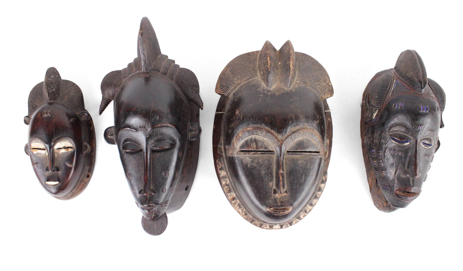 Four African Carved Wood Tribal Masks (1 of 9)