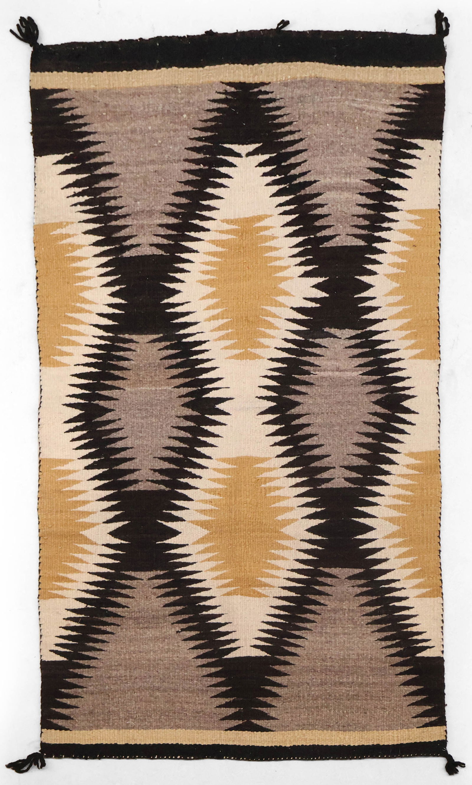 Navajo "Eye Dazzler" Rug: Navajo "Eye Dazzler" RugHeavy flat-woven wool, c. 1900.28 x 54 in. (71.1 x 137.2 cm.)